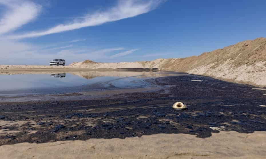 Tar accumulates on the shore after an oil spill off the coast of Huntington Beach, California. According statements by Katrina Foley, Orange county supervisor, the oil spill was caused by a broken pipeline attached to an offshore oil platform.