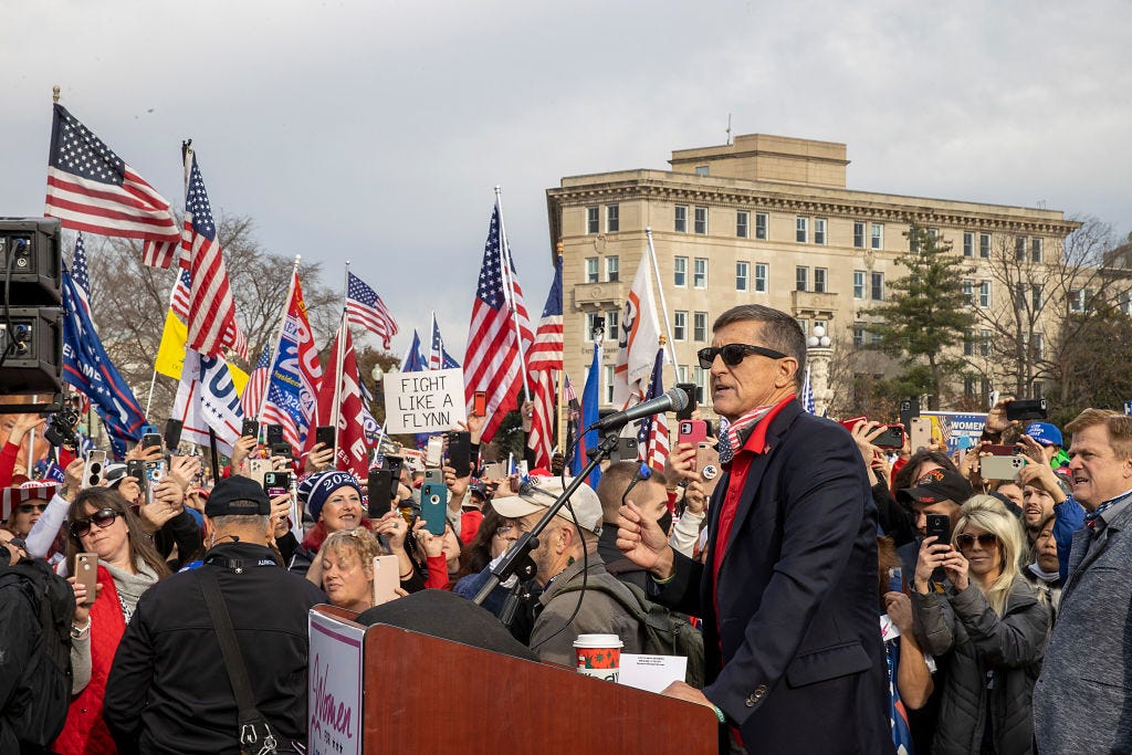 WASHINGTON, DC - DECEMBER 12: Former General Michael Flynn, President Donald Trump’s recently pardoned national security adviser, speaks during a protest of the outcome of the 2020 presidential election outside the Supreme Court on December 12, 2020 in Washington, DC. Thousands of protesters who refuse to accept that President-elect Joe Biden won the election are rallying ahead of the electoral college vote to make Trump's 306-to-232 loss official. (Photo by Tasos Katopodis/Getty Images) WASHINGTON, DC - DECEMBER 12: Former General Michael Flynn, President Donald Trump’s recently pardoned national security adviser, speaks during a protest of the outcome of the 2020 presidential election outside the Supreme Court on December 12, 2020 in Washington, DC. Thousands of protesters who refuse to accept that President-elect Joe Biden won the election are rallying ahead of the electoral college vote to make Trump's 306-to-232 loss official. (Photo by Tasos Katopodis/Getty Images)