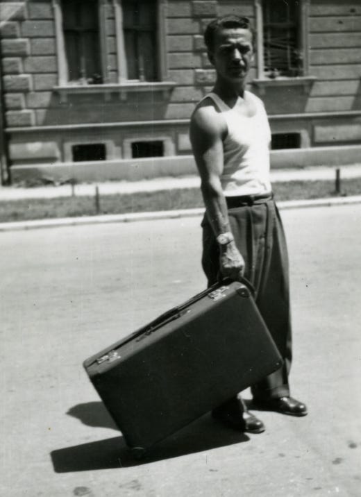 Alfred Krupa and wheeled suitcase circa 1954