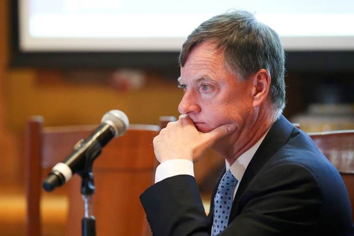 Fed's Evans says policy likely on hold for some time | Reuters