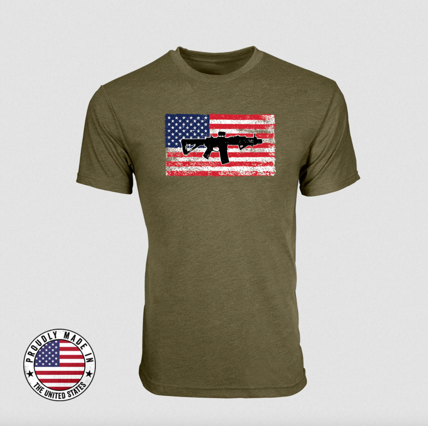 An image of a t-shirt with an assault rifle on top of an american flag.