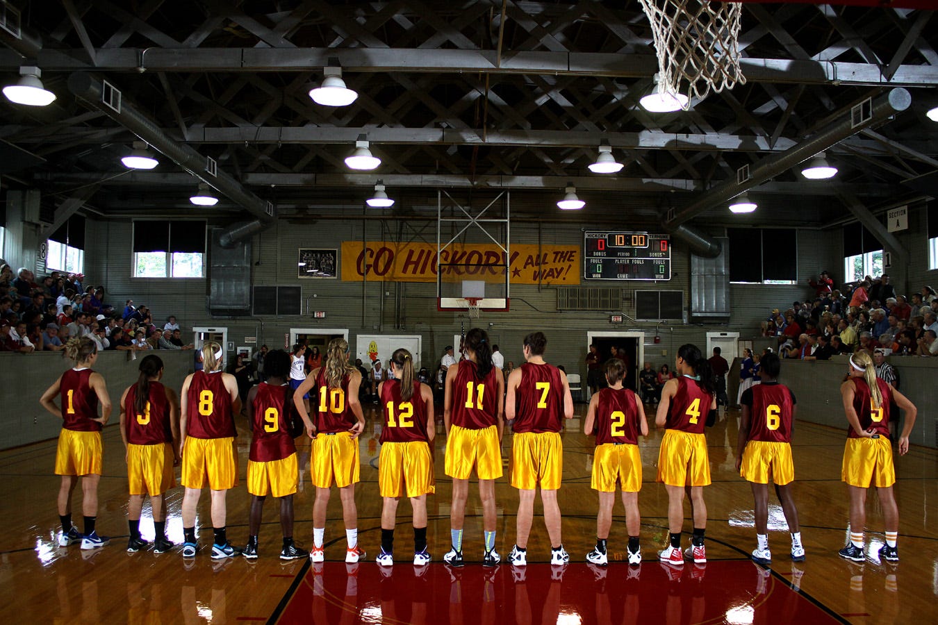 The Lady Hickory Huskers line up for introductions prior to the 2012 game. Some have described their visits to the Hoosier Gym as “stepping into a time machine.” Indeed, this photographer has witnessed grown men cry upon entering what, to them, must be a very special place.