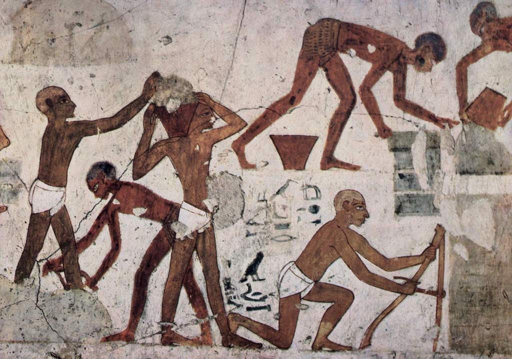 Image of Egyptian mural depicting brown workers in loincloths, working hard.