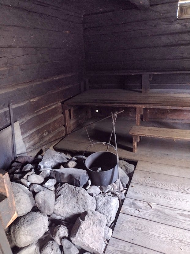 Wooden sauna with rocks