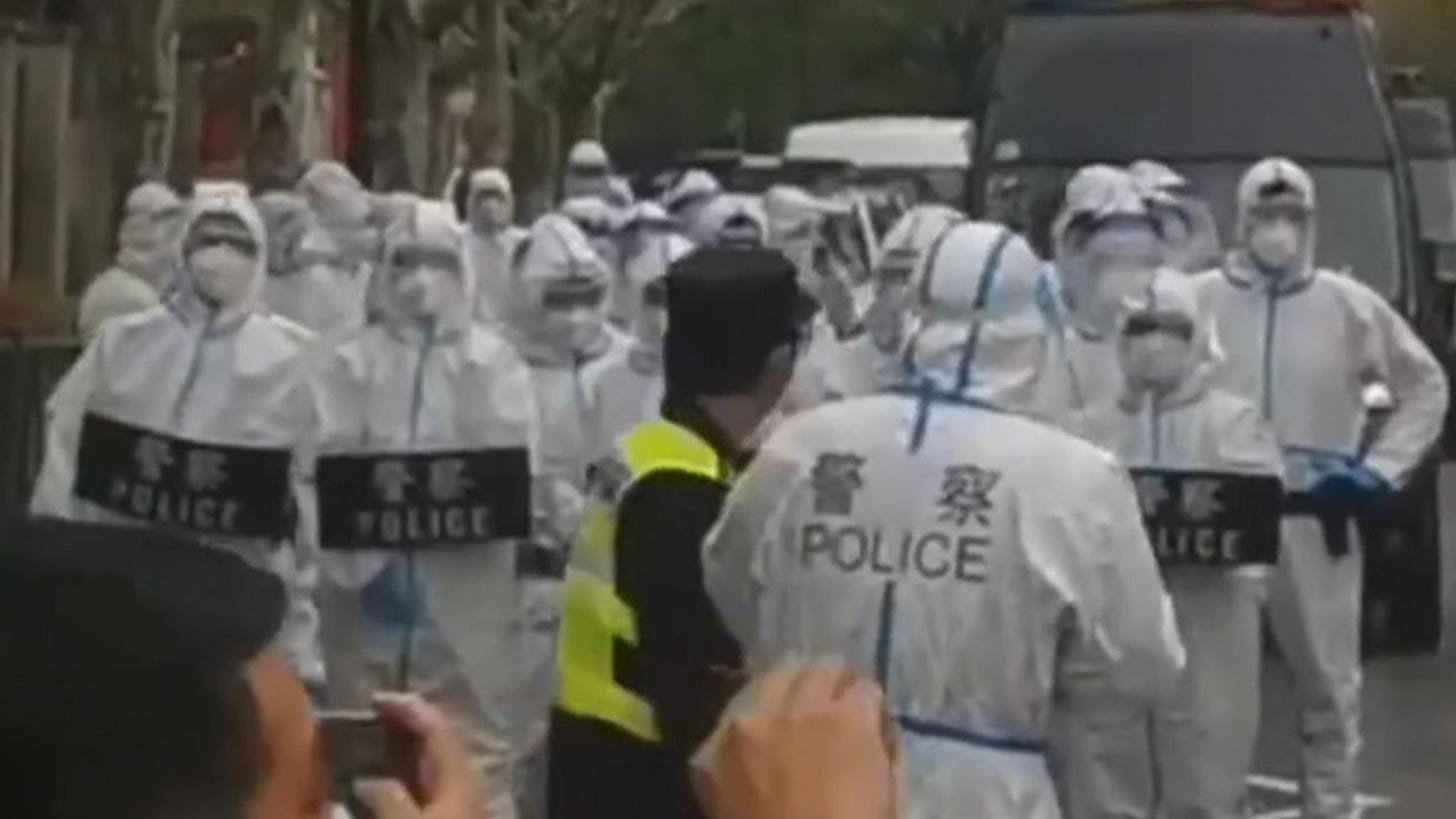Shanghai: Police in hazmat suits push back COVID protesters angry at being  told to give up homes | World News | Sky News