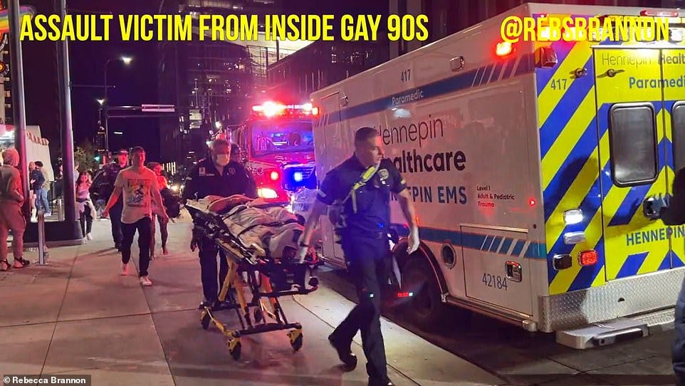 EMS crews brought the assault victim into an ambulance Saturday night