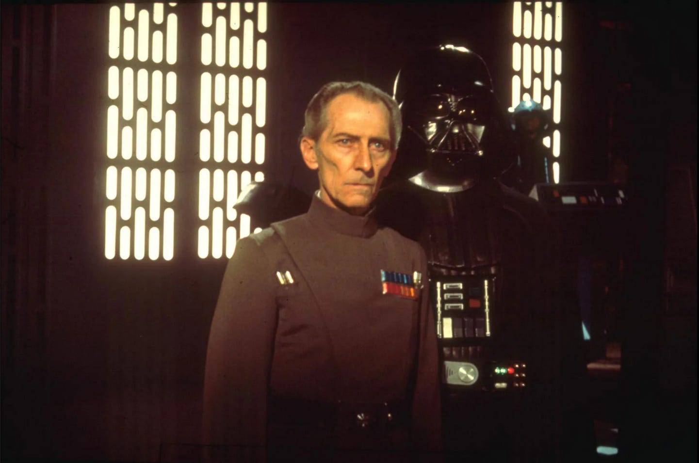 Moff Tarkin and Darth Vader stand in the Death Star control room from Star Wars