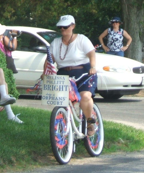 Melissa Pollitt Bright is the cow's tail for this parade.