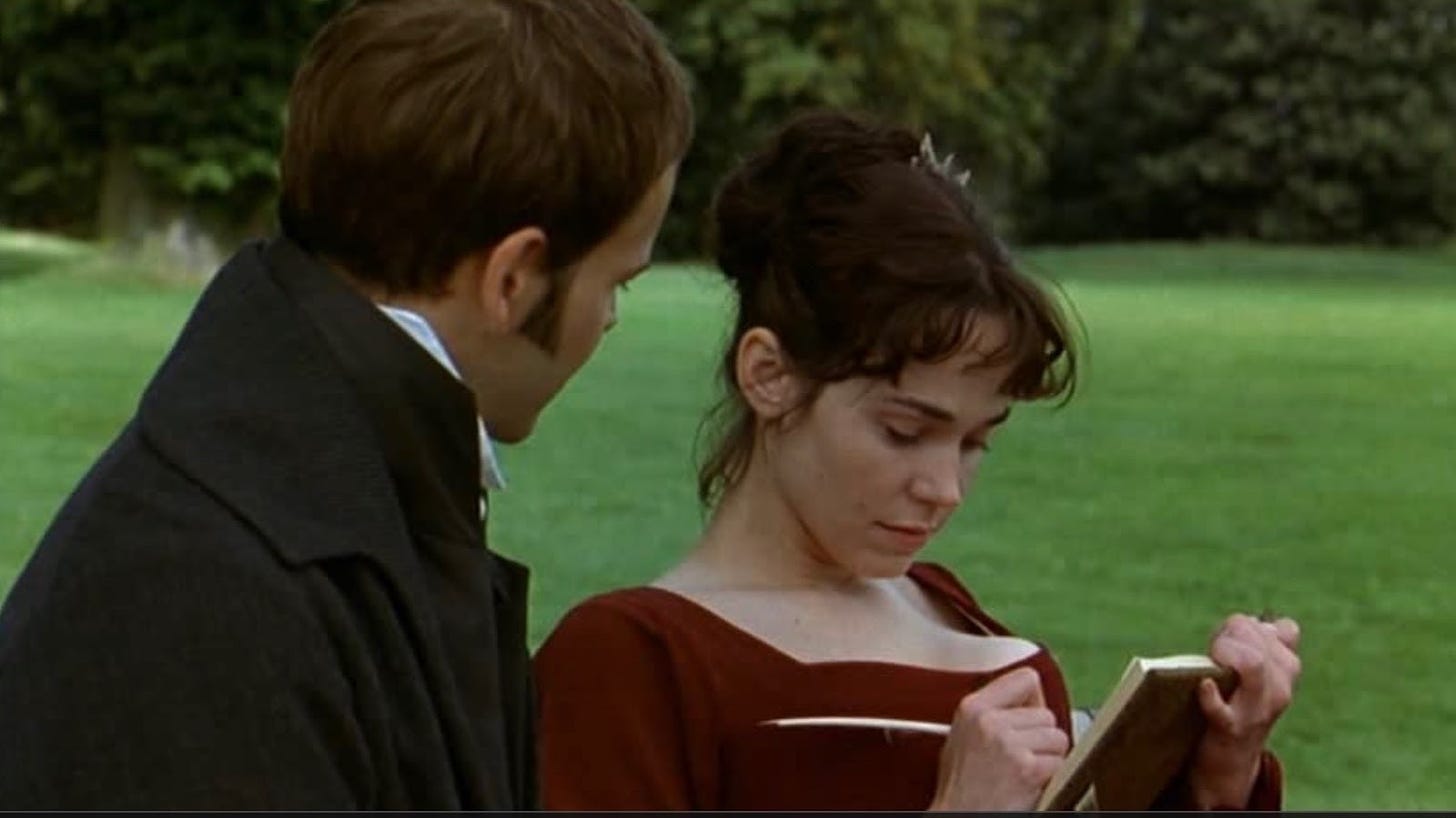 A young, dark-haired woman in a deep red Regency gown sits on the grass reading a book, with a man in dark clothes looking over her shoulder. The actors Frances O'Connor and Jonny Lee Miller portray Fanny Price and Edmund Bertrand in the 1999 production of 'Mansfield Park', directed by Patricia Rozema. 