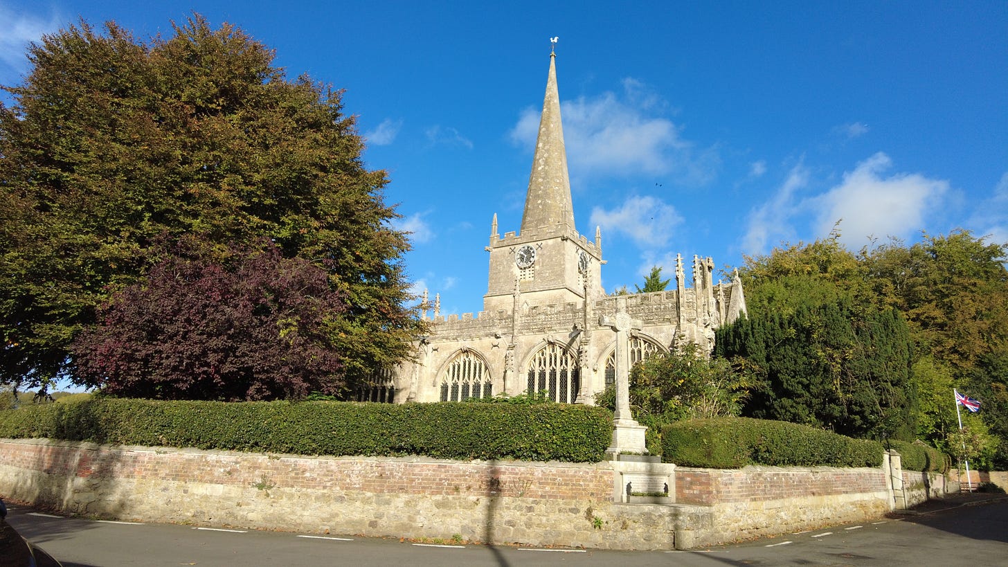 St Nicholas Parish Church, Bromham, Wiltshire. In 1735 the steeple was damaged by a Steeple Flyer. The clock was installed in 1887 as part of Queen Victoria's Jubilee celebrations.