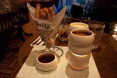 Crystal Sugar Churros Fondue with muddled raspberries and two chocolate dipping sauces