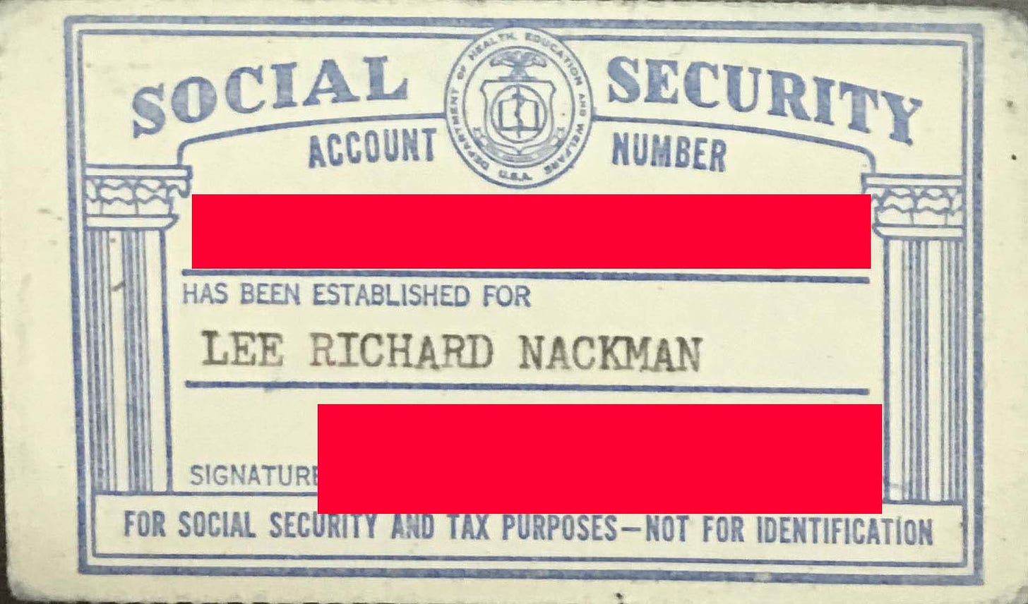 Social security card with personal information obscured.