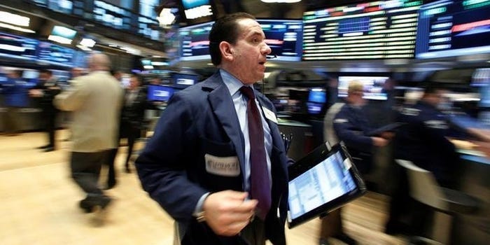 Traders work on the floor of the New York Stock Exchange (NYSE) in New York City, U.S., January 24, 2017.  REUTERS/Brendan McDermid