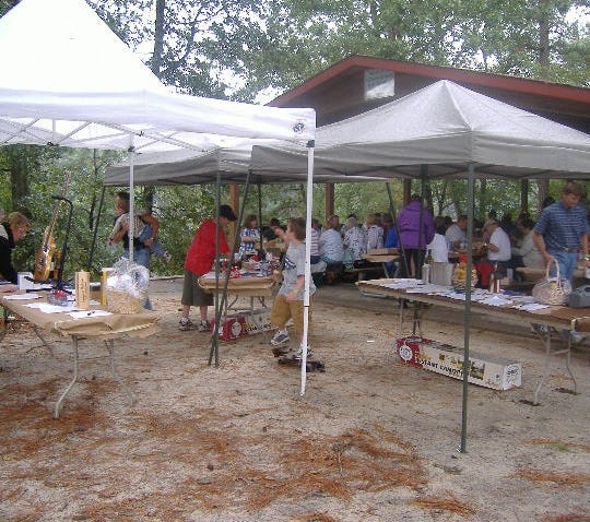 The silent auction tables with their wares.