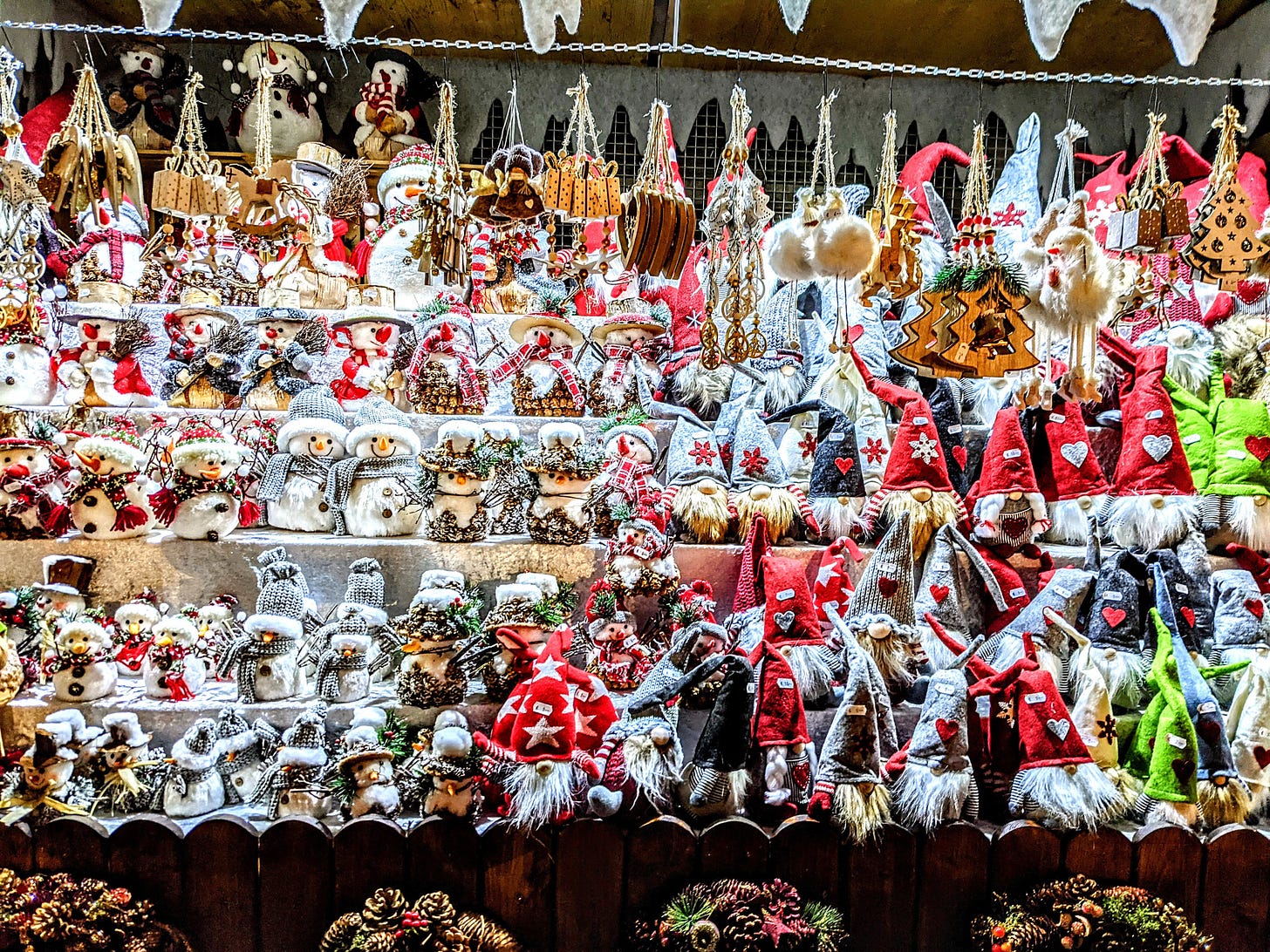 A collection of snowmen, elves, and other Christmas decorations for sale at a book in Vienna's Christkindlmarkt.