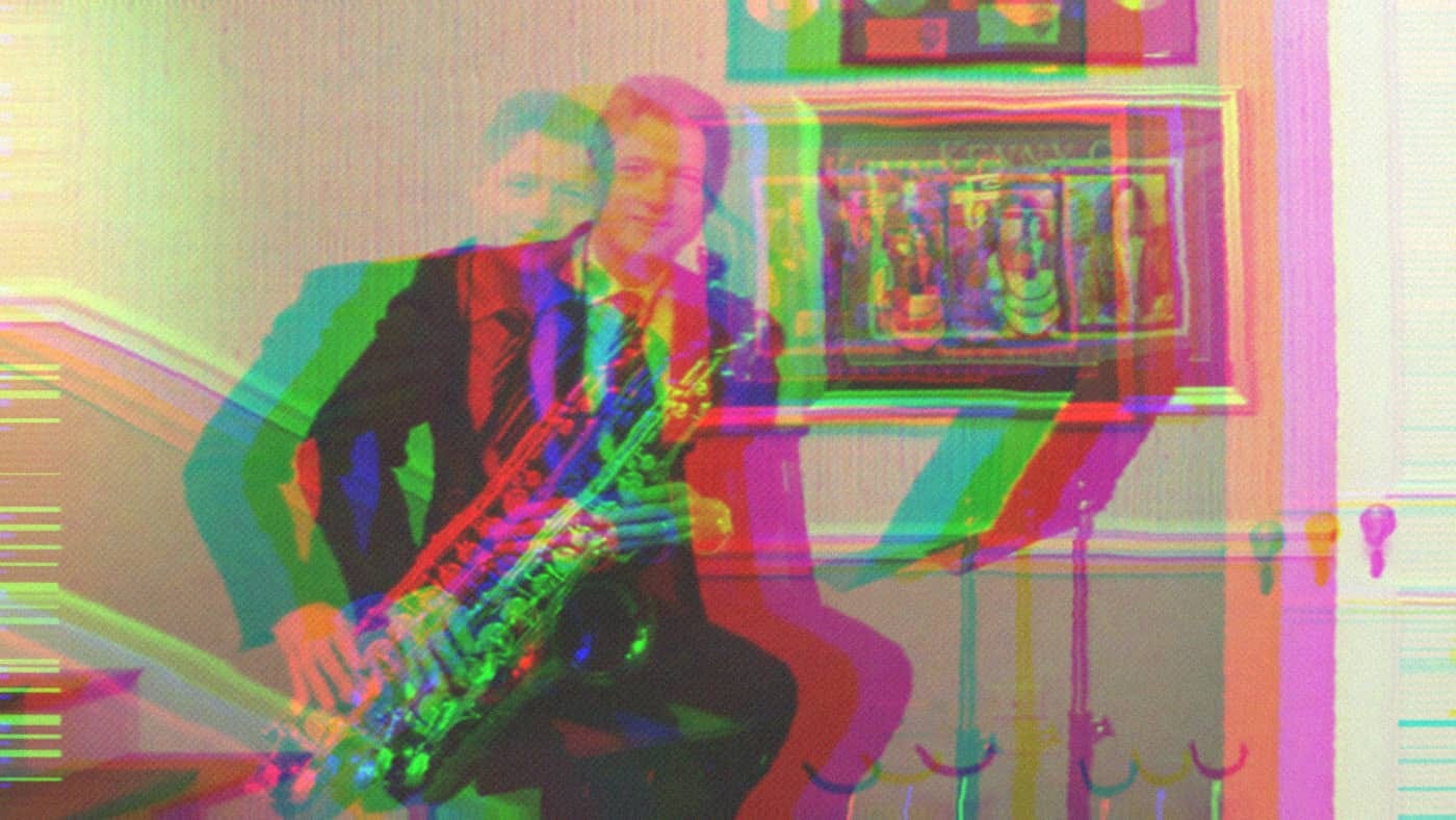Bill Clinton in the White House Music Room holding his saxophone.
