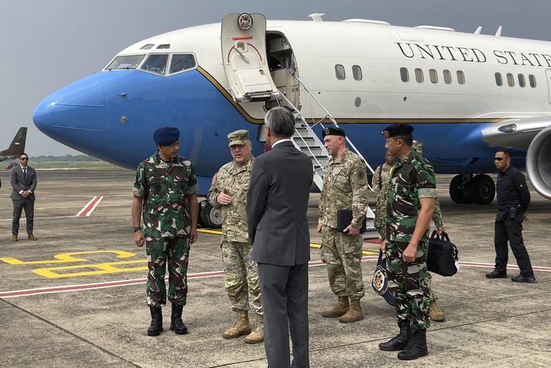 U.S. Army Gen. Mark Milley, center left, chairman of the US Joint Chiefs of Staff, arrives in Jakarta on Sunday, July 24, 2022,  for meetings with defense leaders. The Chinese military has become significantly more aggressive and dangerous over the past five years, the top U.S. military officer said during a trip to the Indo-Pacific that included a stop Sunday in Indonesia. (AP Photo/Lolita C. Baldor)