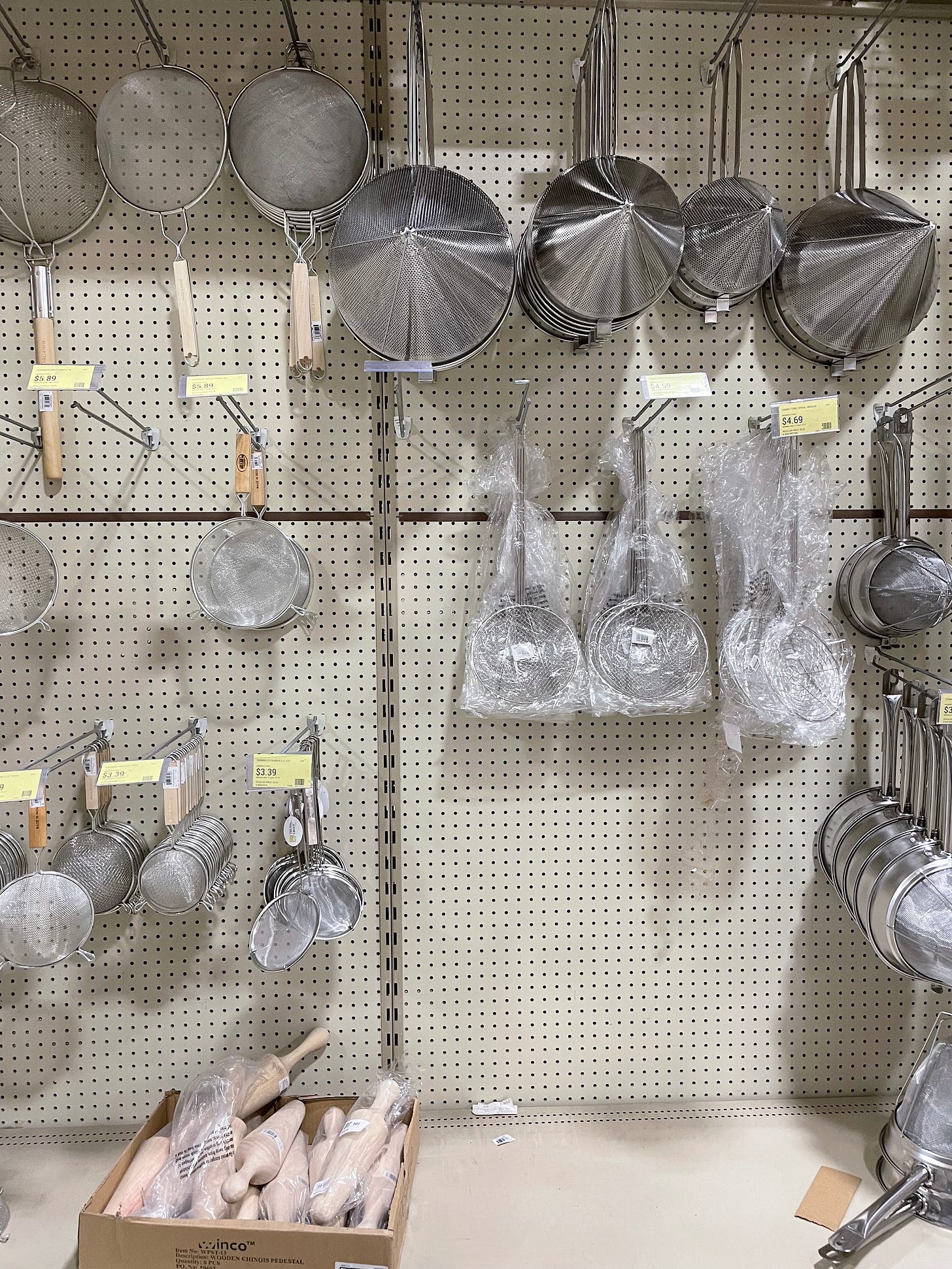 Metal strainers for sale at the restaurant store