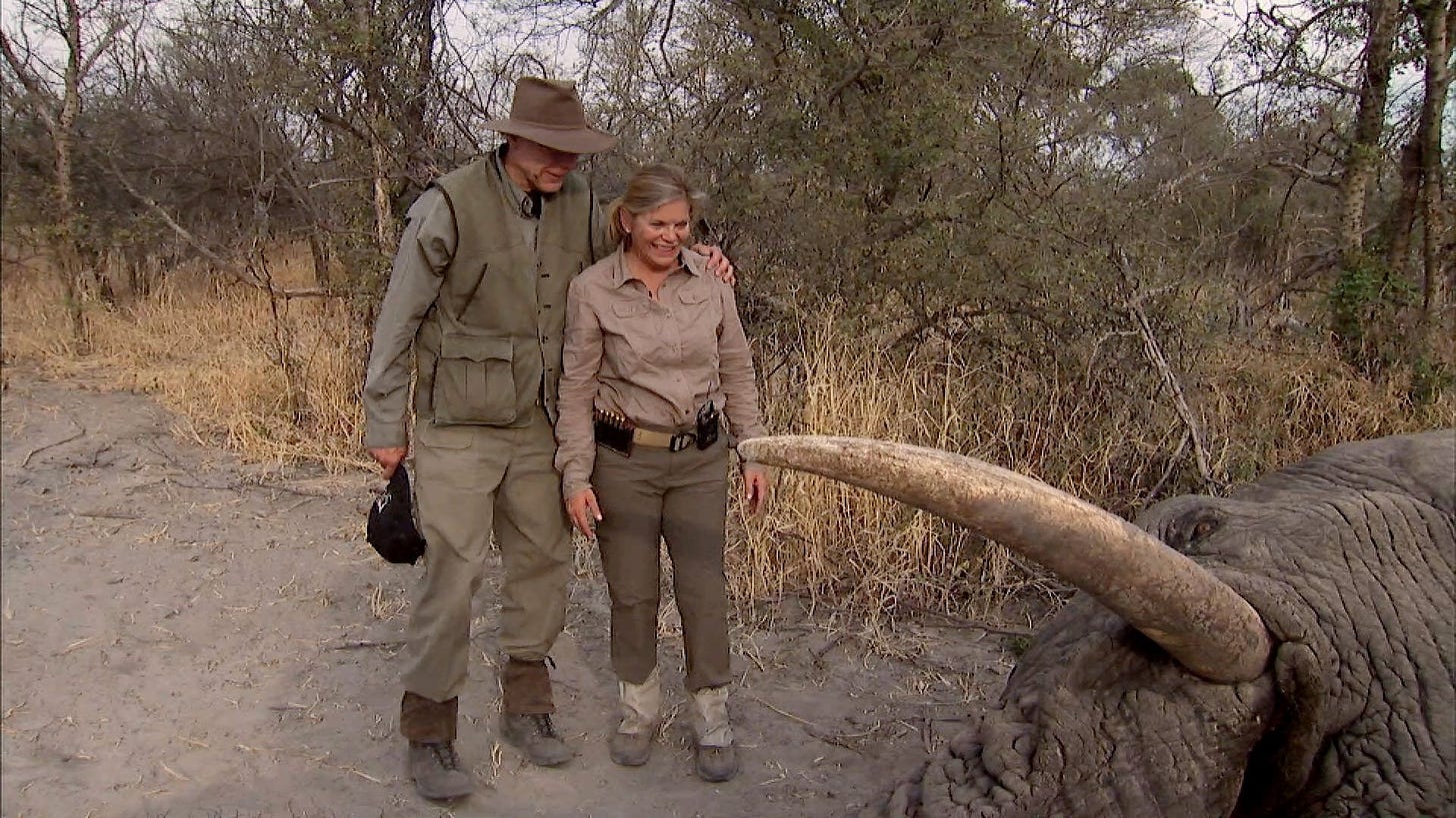 Photo showing NRA chief Wayne LaPierre and his wife, Susan, standing over a dead African bush elephant.