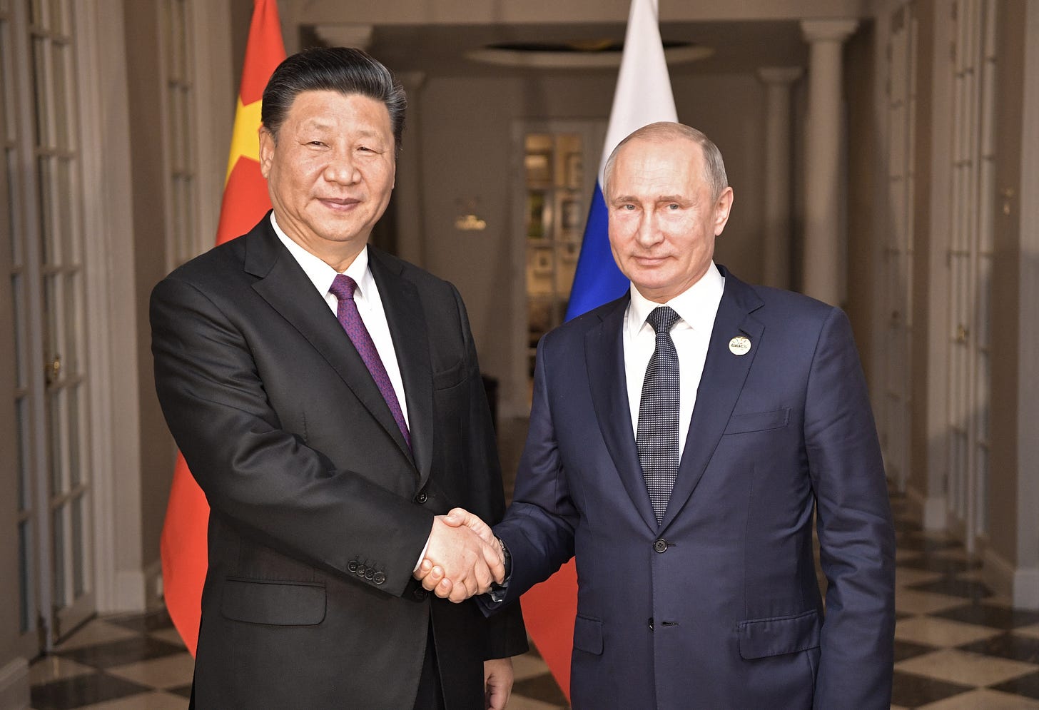 "File:Vladimir Putin and Xi Jinping, 26 july 2018 (1).jpg" by Пресс-служба Президента Российской Федерации is marked with CC BY 4.0.