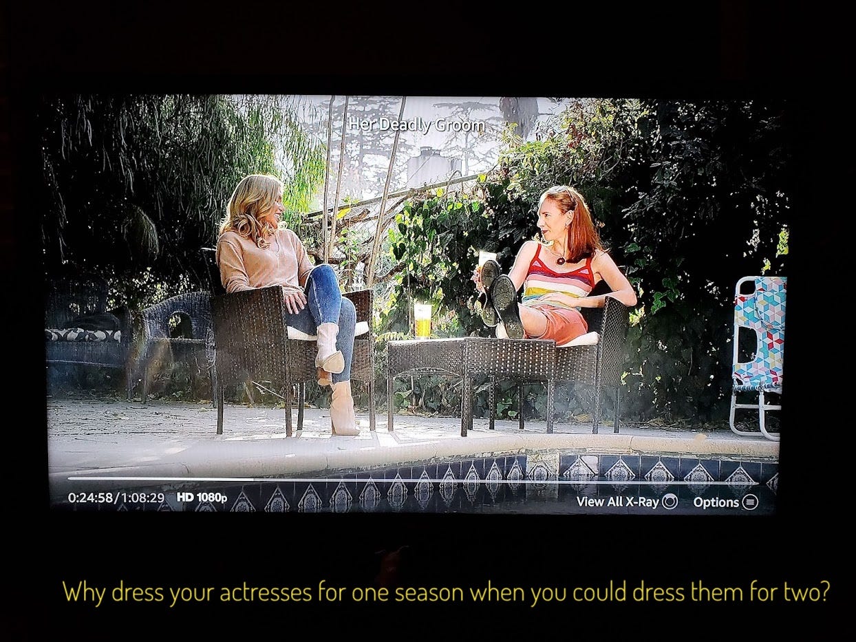 Alison, in a sweater and jeans, chatting with Bren, in a tanktop and shorts, by the pool. Captioned "Why dress your actresses for one season when you could dress them for two?"