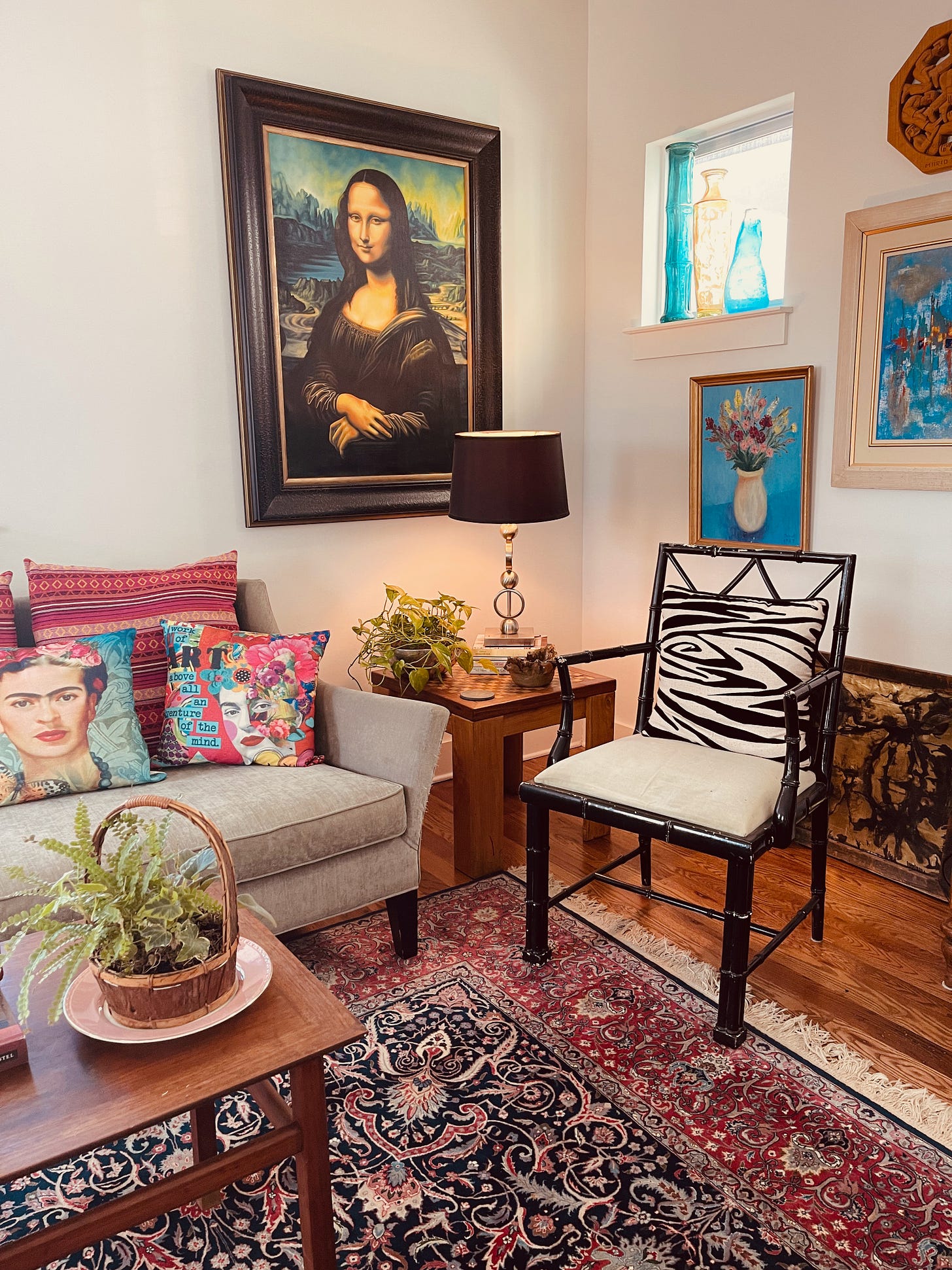 Mona Lisa painting and Frida pillows, oriental rugs and zebra prints make this home decor stand out.