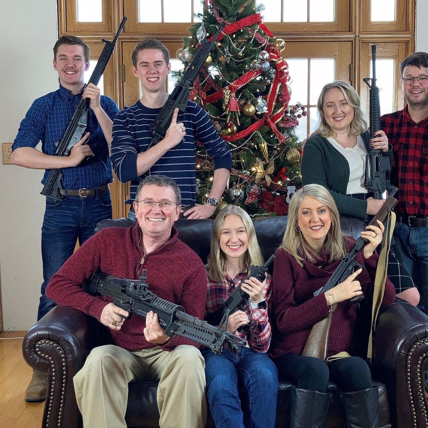 U.S. congressman posts family Christmas picture with guns, days after  school shooting | Reuters