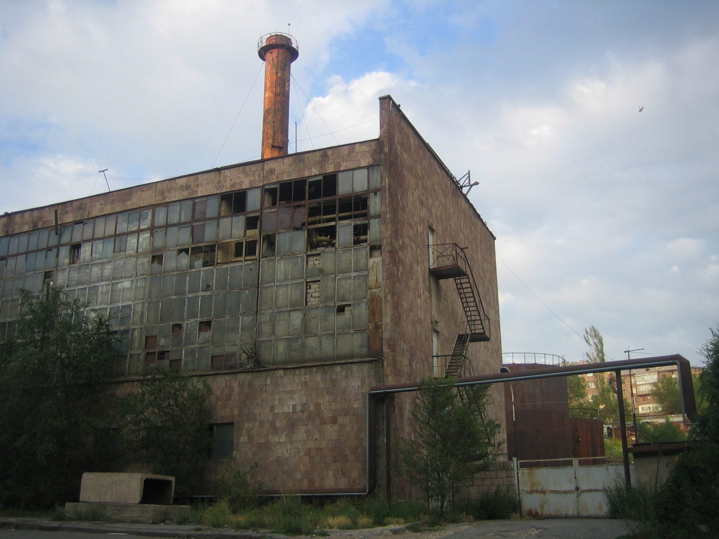 "File:Dilapidated Soviet Factory - panoramio.jpg" by serouj is marked with CC BY-SA 3.0.