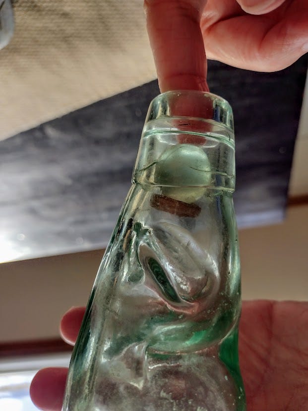 Opening a Codd bottle Opening a Codd bottle