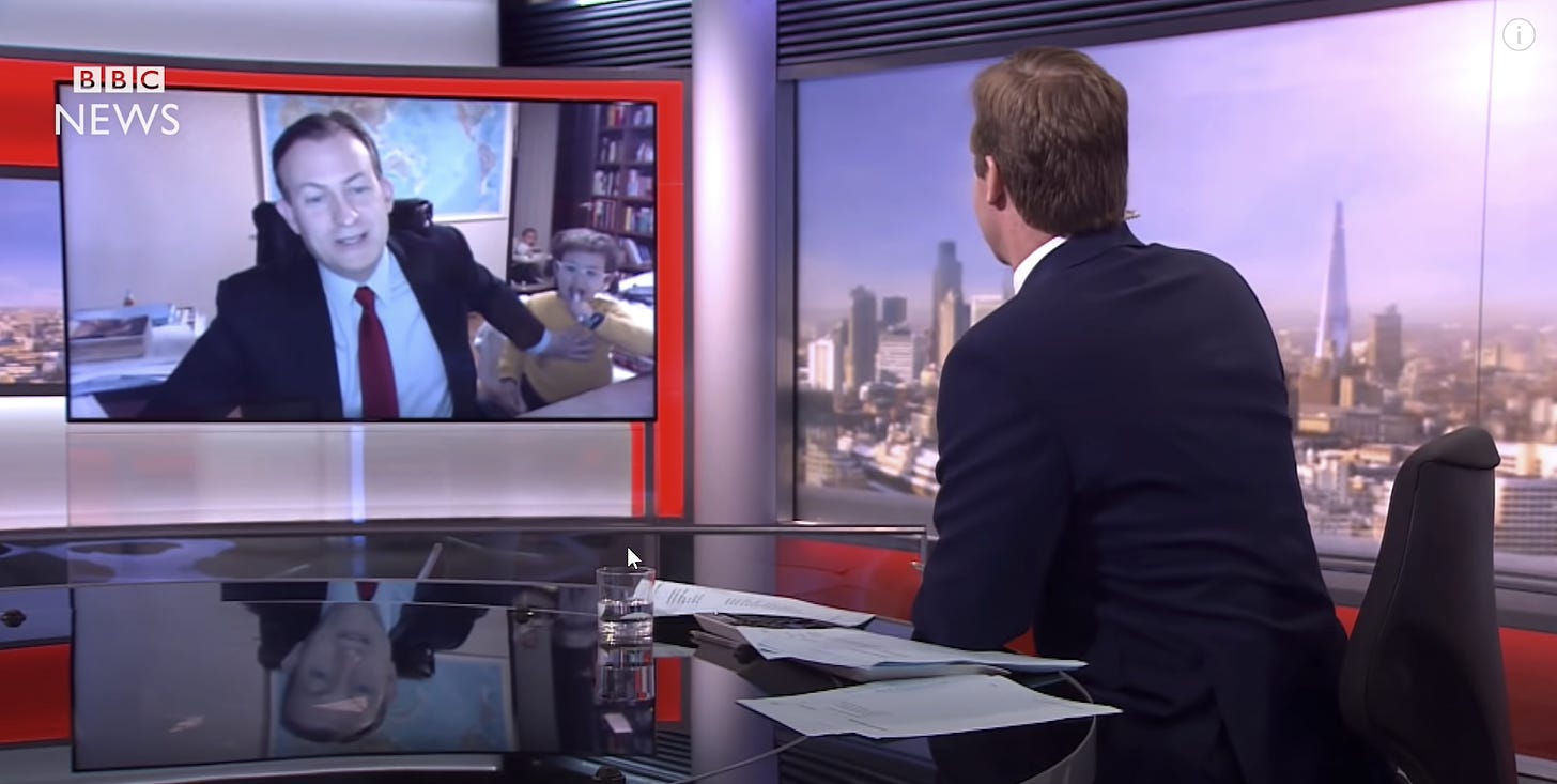 A person interviewed on the BBC, interrupted by their small child.