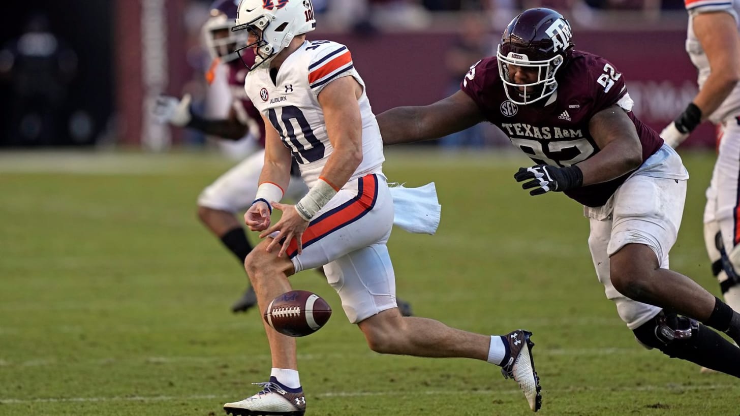 Auburn quarterback Bo Nix (10) fumbles the ball as Texas A&M defensive lineman Jayden Peevy (92) defends during the second half of an NCAA college football game Saturday, Nov. 6, 2021, in College Station, Texas. Texas A&M recovered the fumble for a touchdown. Texas A&M won 20-3. (AP Photo/David J. Phillip)