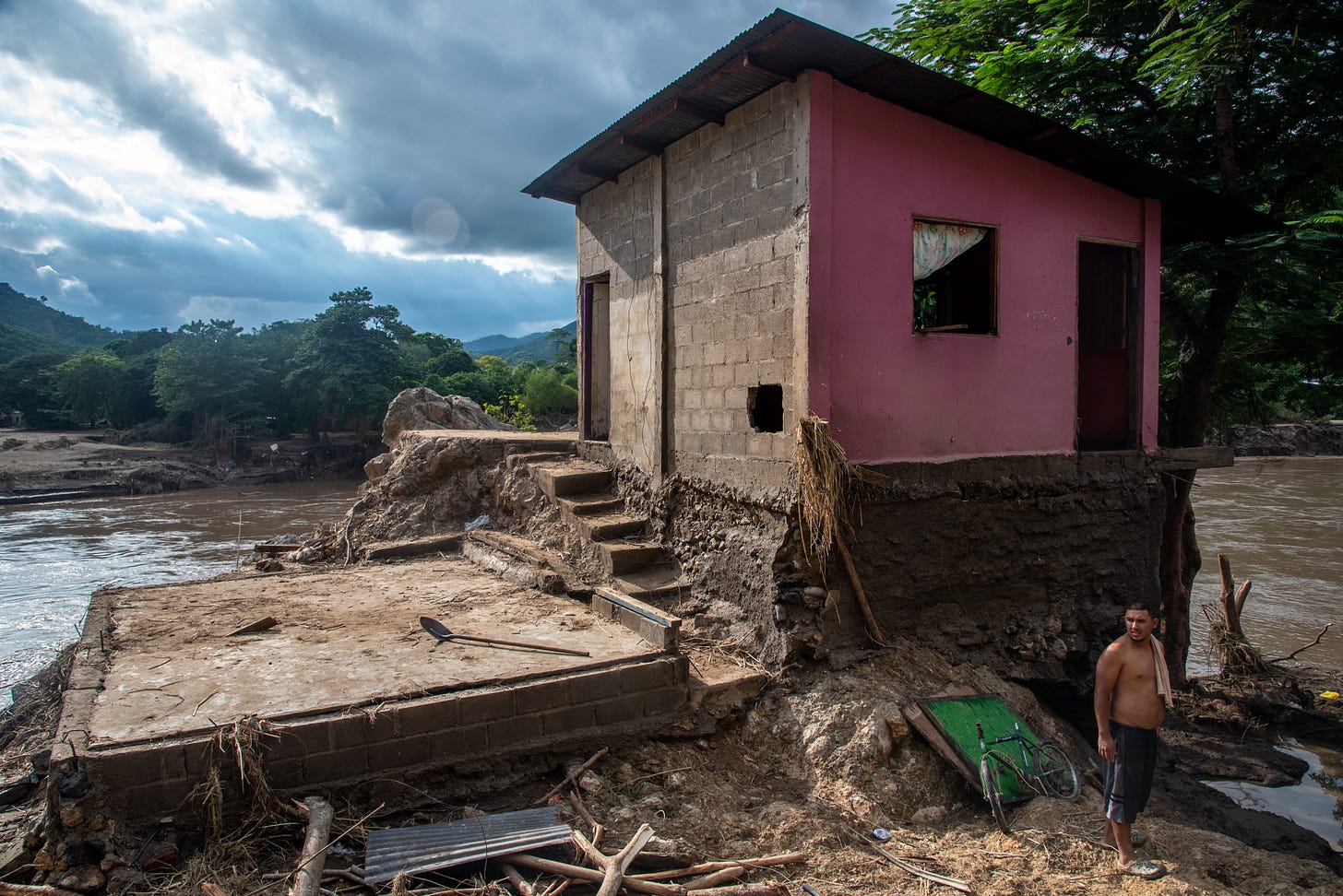 SAN PEDRO SULA, CORTES, HONDURAS - 2020/11/07: A man in front of his home that was destroyed when the Chemelecon River flooded in San Pedro Sula