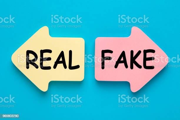 Two arrows reading REAL and FAKE with iStock watermark