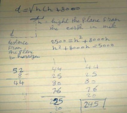 A photo of a notepad with handwritten equations and a representation of an airplane in flight