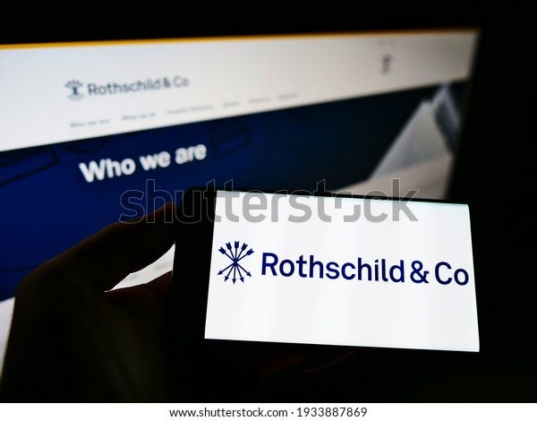Stuttgart, Germany - 03-05-2021: Person holding smartphone with logo of French financial services company Rothschild Co. SCA on screen in front of website. Focus on phone display. Unmodified photo.