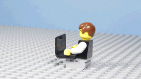 LEGO man throwing LEGO laptop in frustration
