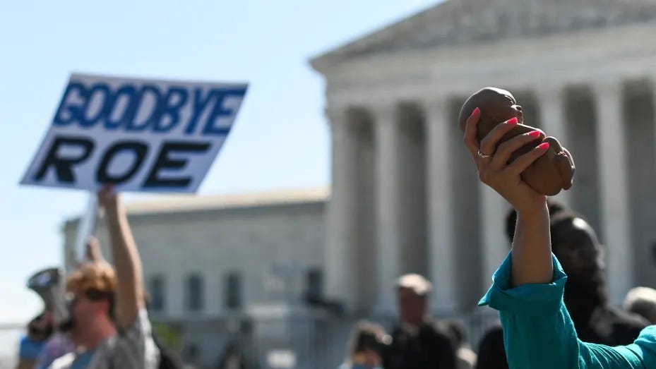 Pro life protestors march in front of the Supreme Court building amid the ruling that could overturn Roe v. Wade on June 13, 2022 in Washington, DC.
