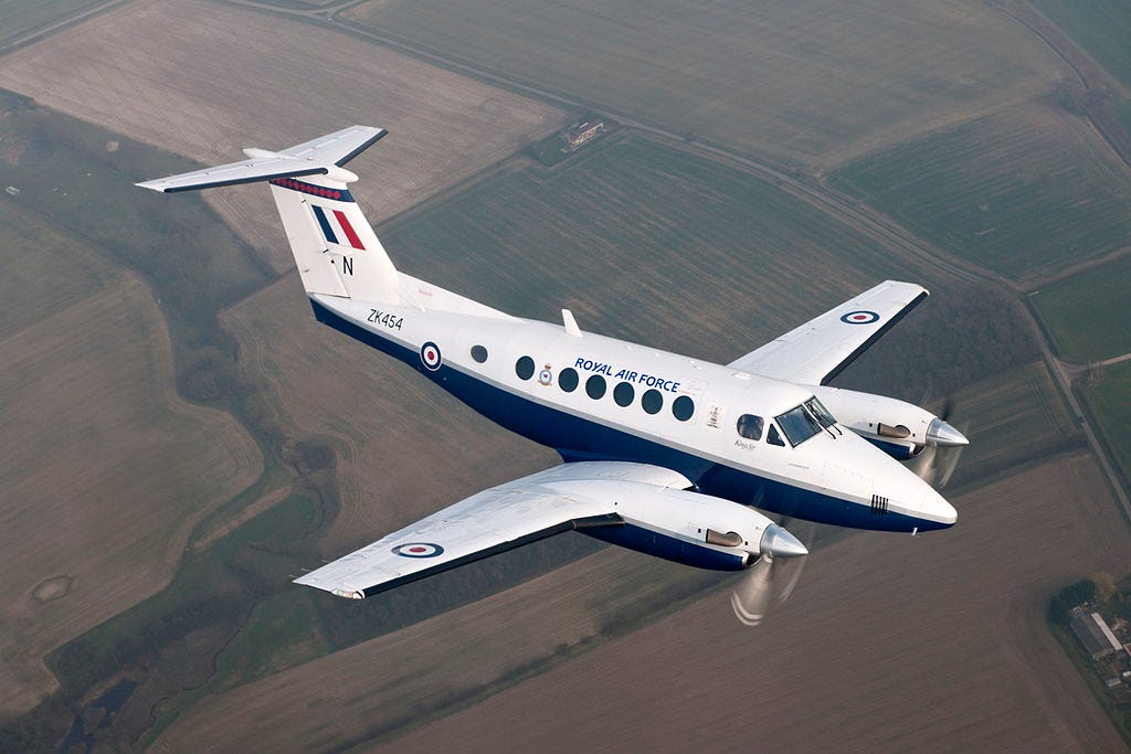A Royal Air Force Beech King Air B200 in flight over the English countryside