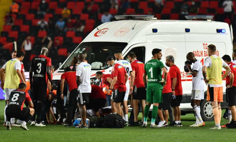 An ambulance crew attend to Fabrice Nsakala after the Besiktas defender collapsed on the pitch. 