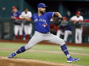 Toronto Blue Jays starting pitcher Tanner Roark pitches in the first inning against the Texas Rangers at Globe Life Field on Tuesday night. The pitcher gave up three home runs in three innings in the loss.