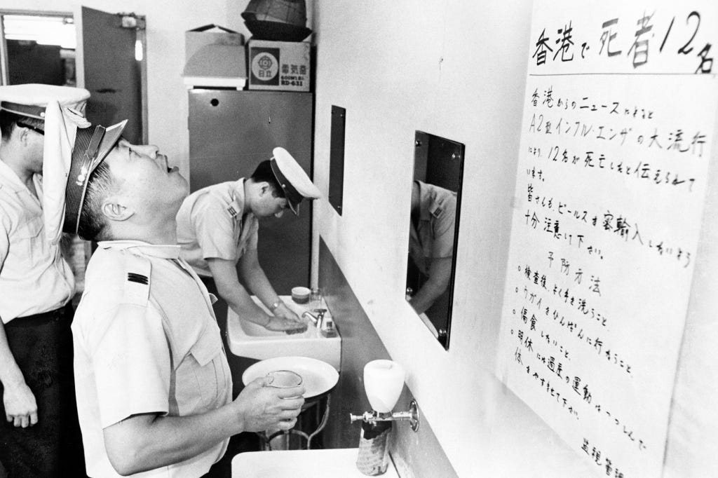 Custom officers wash their hands at Haneda Airport during the “Hong Kong Flu” epidemic in 1968. Once again, Communist authorities refused to alert the world about its spread, and another million people died.