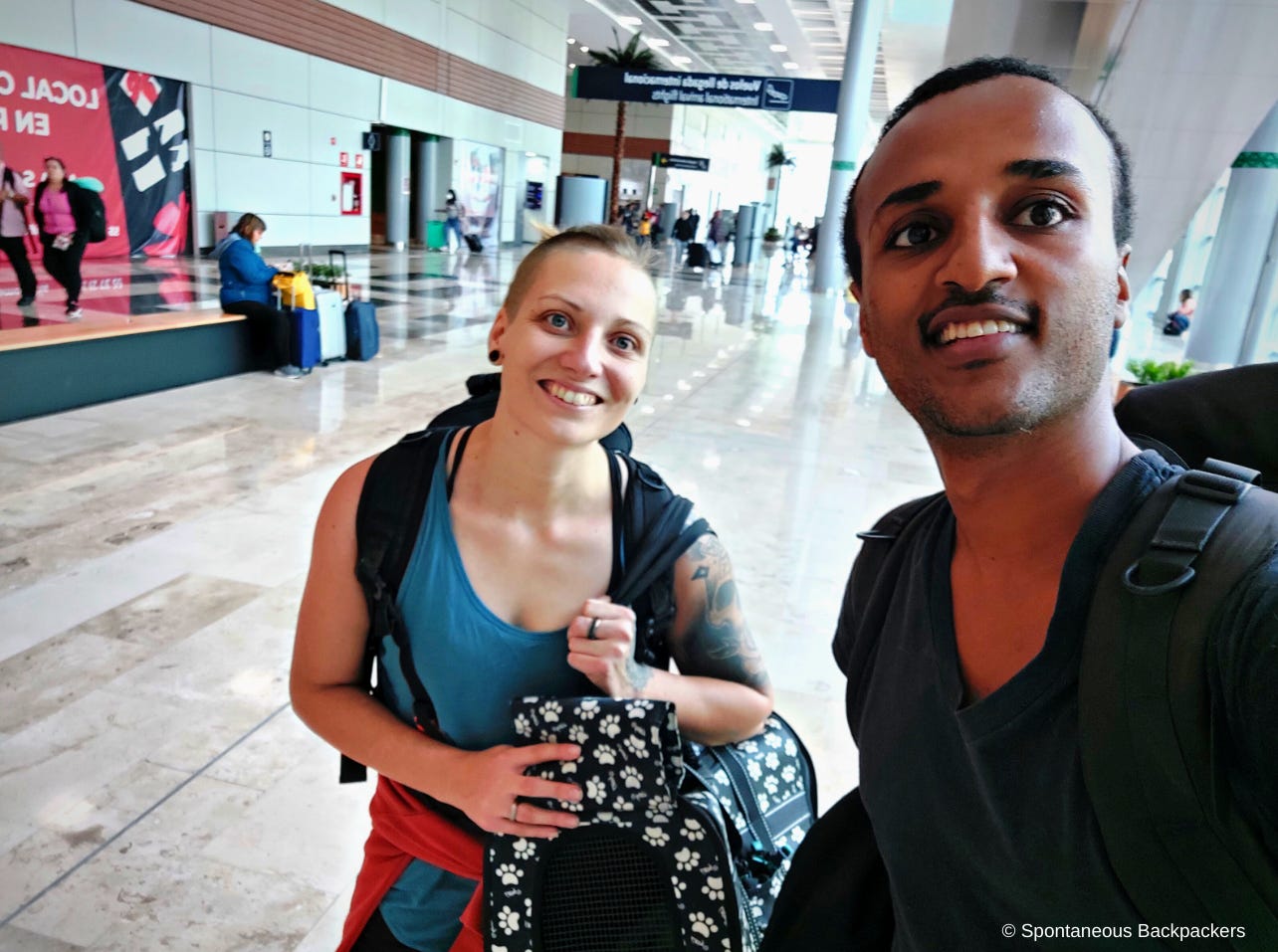 Spontaneous Backpackers at the Airport taking a selfie before flight