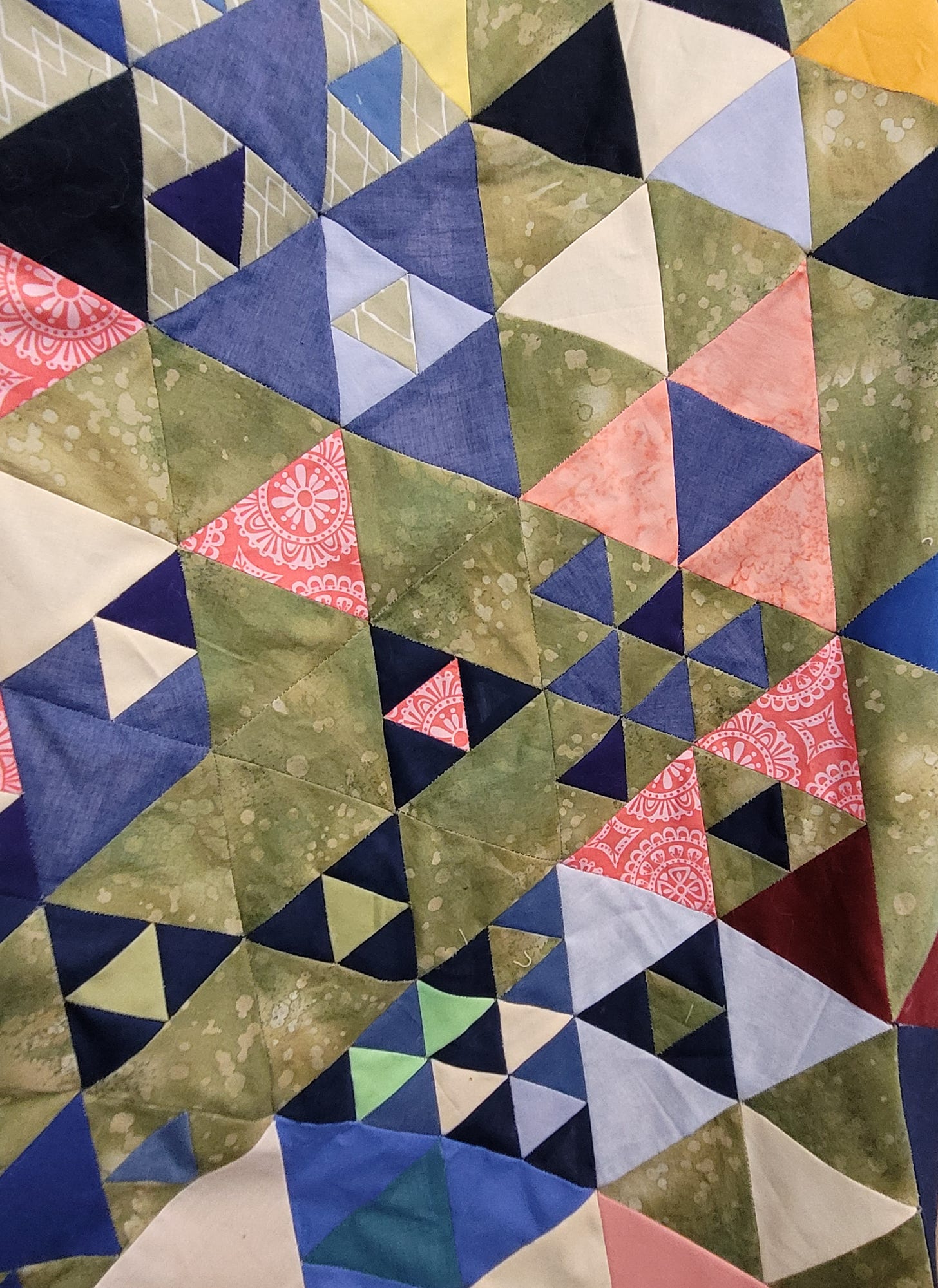 EPP Triangle Quilt in blues, olives, and melon colors
