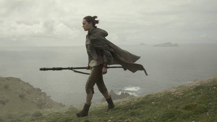 Rey is standing on a sea cliff