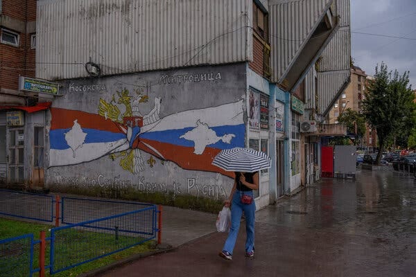 A mural reading “Kosovo is Serbia — Crimea is Russia” in the main square in the mainly ethnic Serb part of Mitrovica.