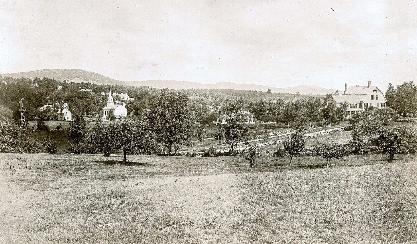 Open field with view of church and Tarbell-Ames house