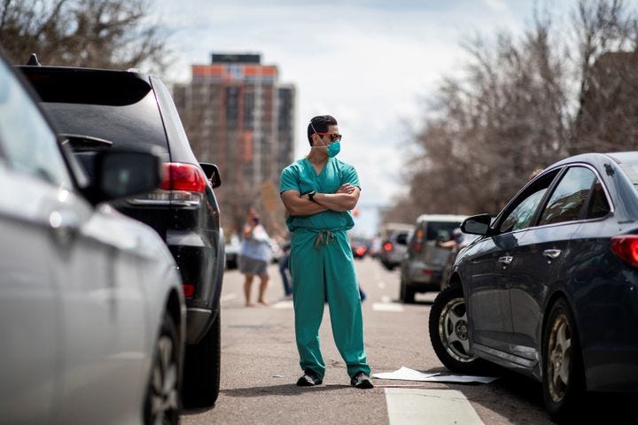 Hundreds gathered in Denver on Sunday for what they called “Operation Gridlock.” A small cadre of health care workers opposed them.