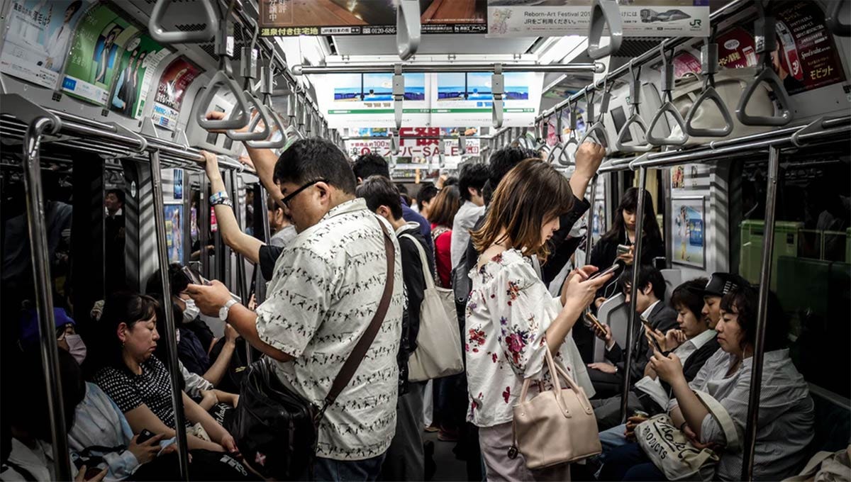 subway-people-on-phone-Branding-in-Asia