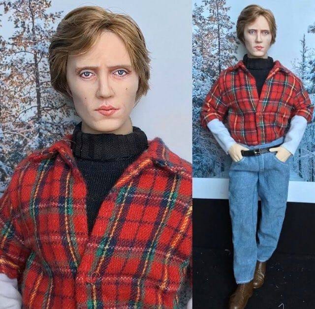 A creepily life-like doll of Christopher Walken dressed in his outfit from the Deer Hunter.