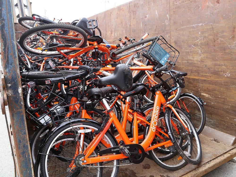 Dozens of orange DropBikes were placed in two dumpsters outside of Cook Brothers Youth Centre in Kingston on Monday April 22, 2019.  Ian MacAlpine/The Whig-Standard/Postmedia Network